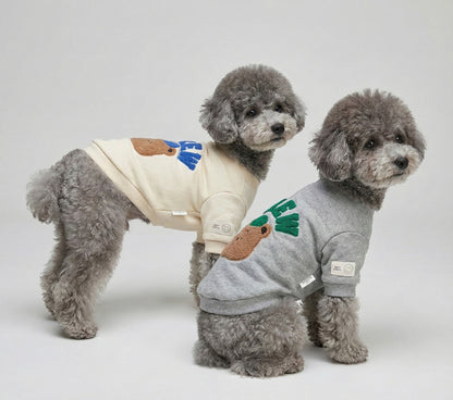 Front view of two poodles in matching CREW bear sweatshirts