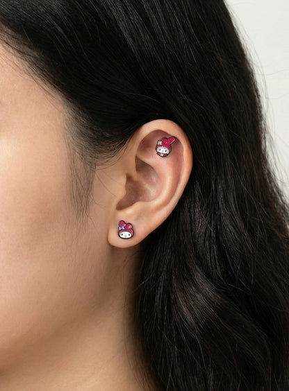  Side view of My Melody barbell studs worn in lobe and helix piercings 