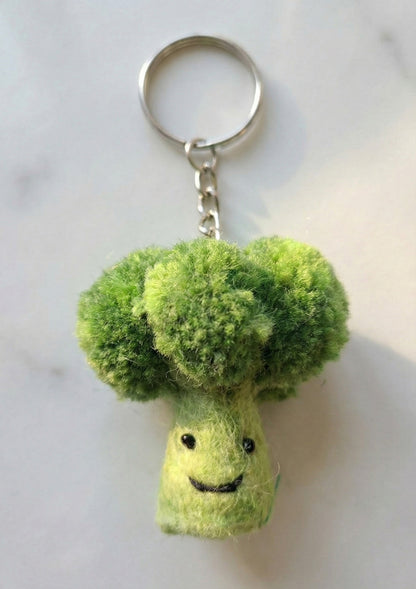 Fluffy broccoli wool felt keychain with voluminous green top and happy face"