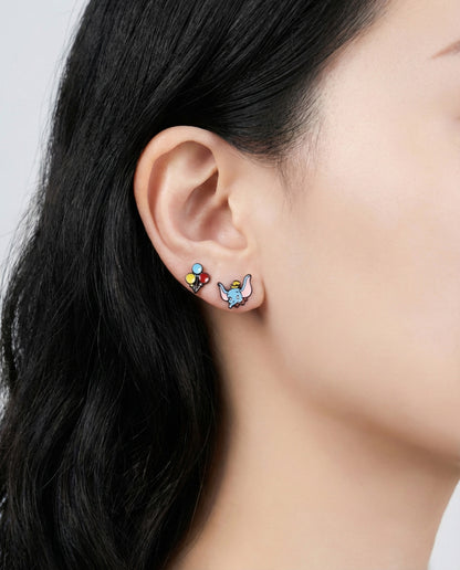 Elephant and balloon earrings on ear - kawaii mismatched character jewelry