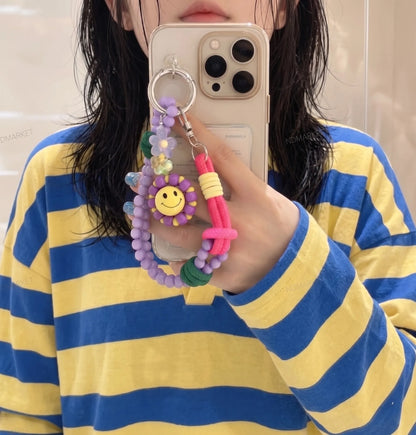 Coquette Y2K phone charm aesthetic 8ttitto8 lavender smiley flower bead strap keychain, mirror selfie with stripe oversized top.