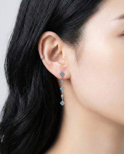 Turquoise blue clover dangle earrings showing vintage milgrain setting detail