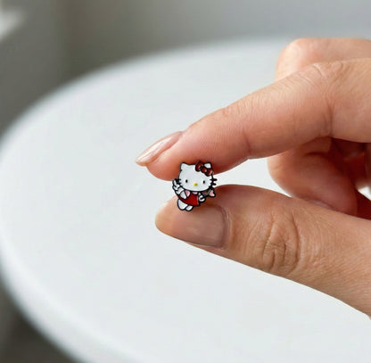 Close-up of Angel Cupid Hello Kitty stud showing detailed enamel work and glossy finish, handmade in Korea
