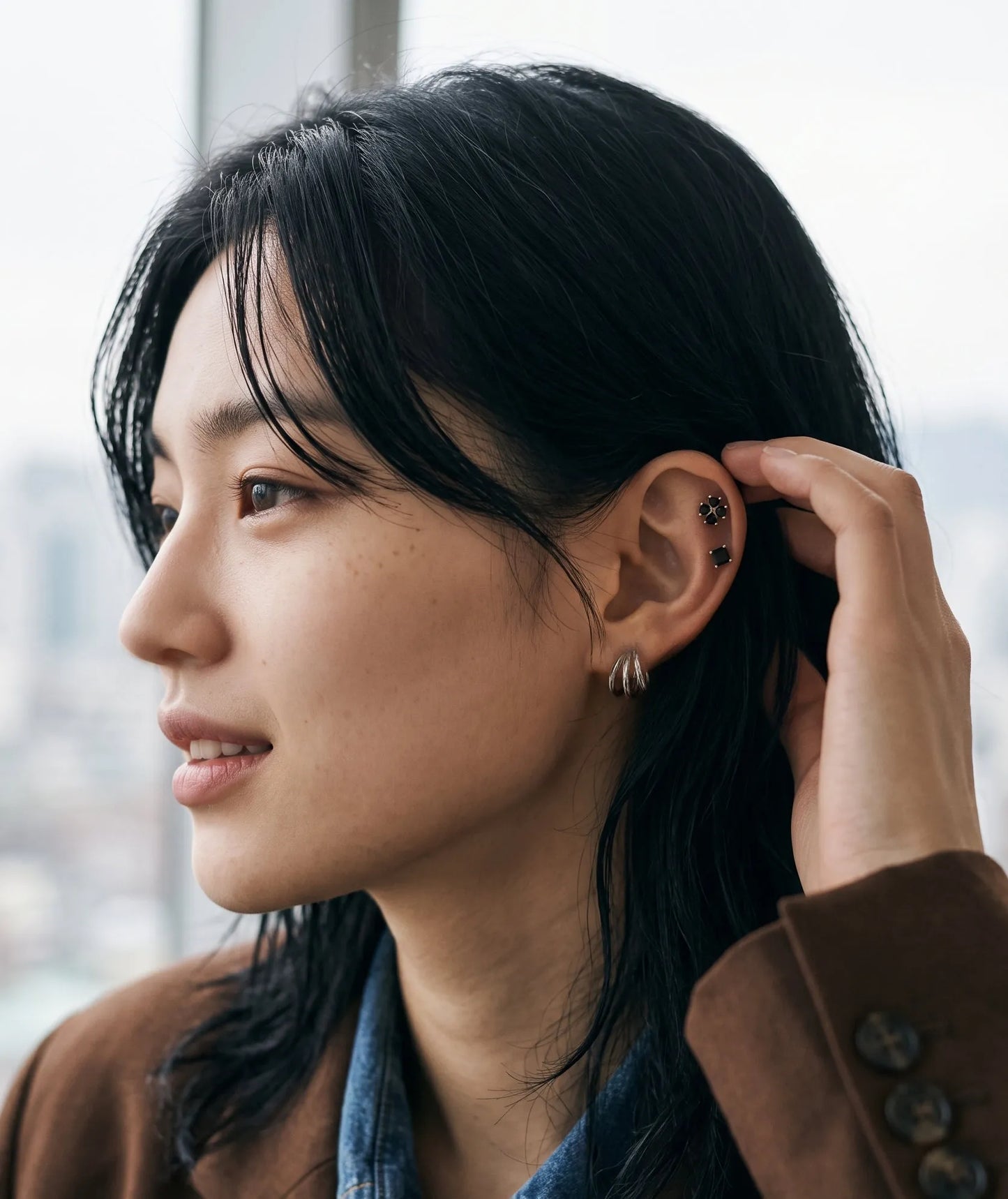 Downtown girl ear piercing inspo, clover tragus stud with hoop mismatch look.