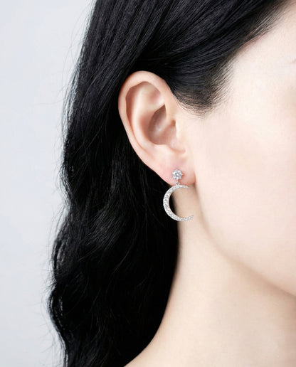 Full view of celestial asymmetric earrings on model