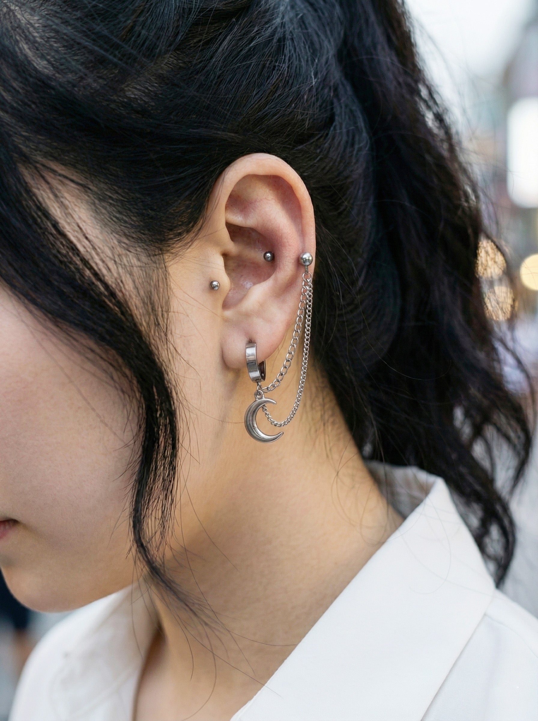 Street style look with surgical steel moon connected chain piercing and white shirt