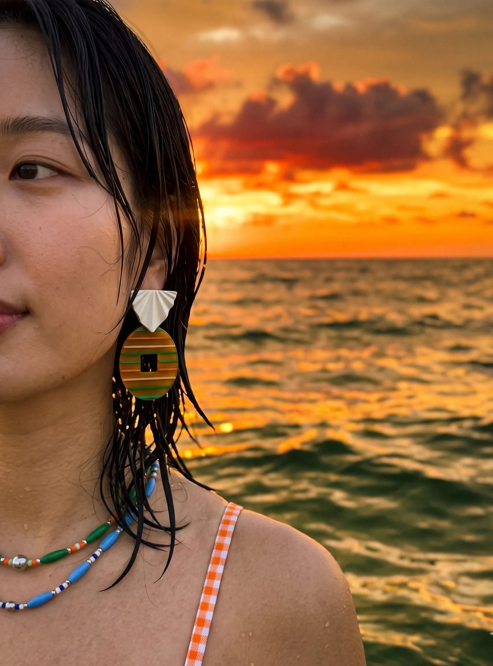 Sunset vacation amber stripe acrylic drop earrings with layered bead necklace, K-style ear stack