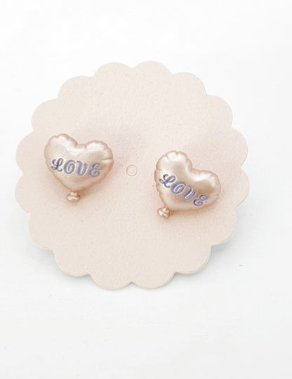  Champagne beige pearl finish heart balloon earrings with blue LOVE script