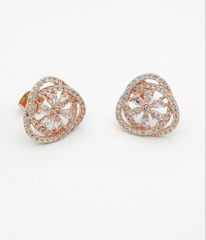 Pair of rose gold heart-shaped cubic zirconia stud earrings with flower motif center on white background, 925 sterling silver posts hypoallergenic