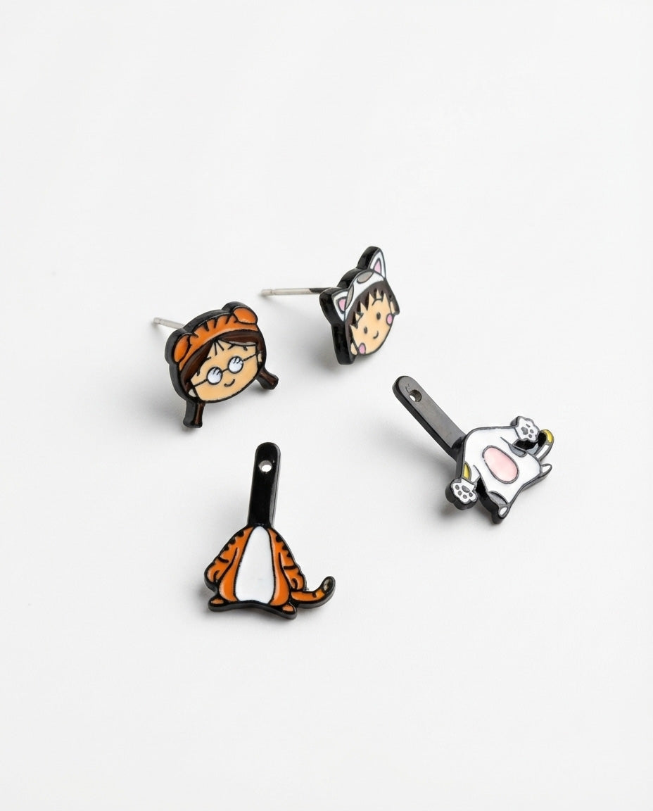 Disassembled earring set showing all four components - two studs and two drop charms