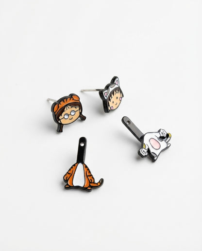 Disassembled earring set showing all four components - two studs and two drop charms