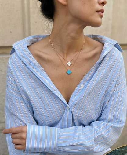 Rose gold onyx clover necklace and earring set worn with blue brown stripe shirt layered cut K-fashion daily jewelry look.