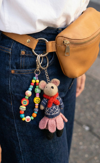 Casual denim outfit styled with nordic navy ballerina mouse keychain clipped to belt loop and crossbody bag