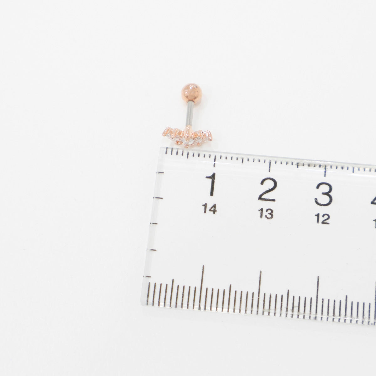 Size comparison of wing marquise cubic stud with ruler showing 8mm decoration length