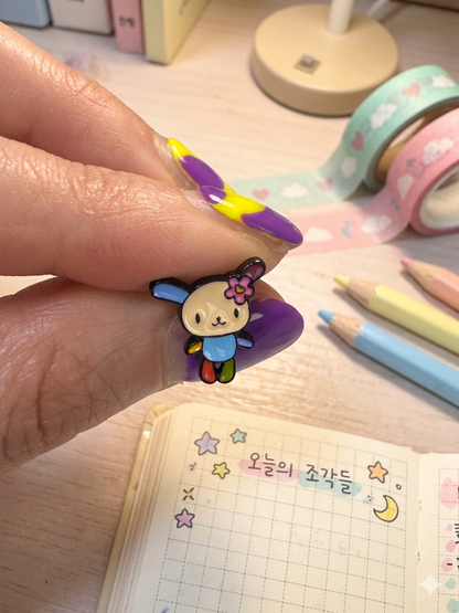 Handmade Usahana flower enamel stud held in hand — kawaii Seoul aesthetic, Sanrio character jewelry detail shot — 8ttitto8
