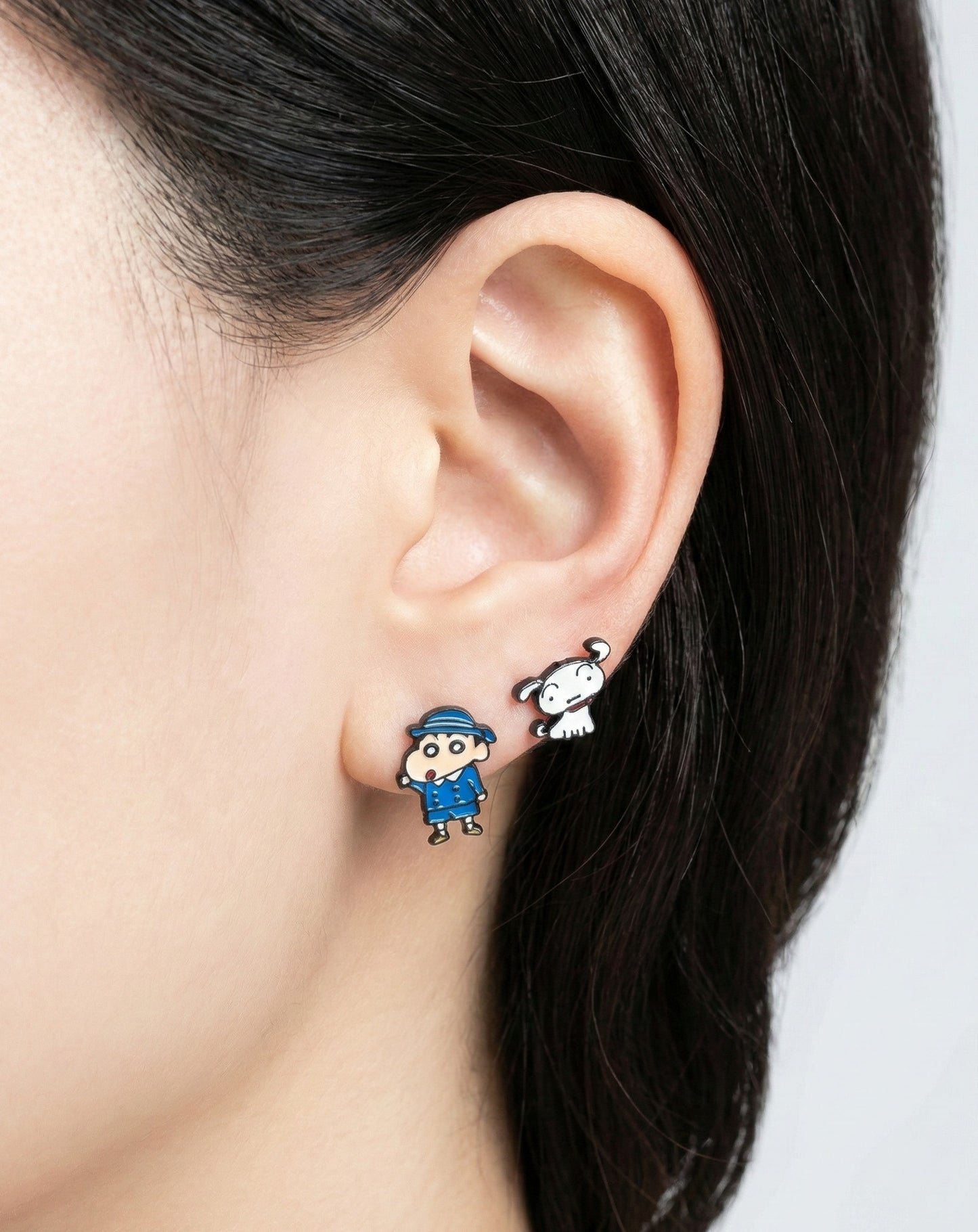  Model wearing Shin-chan school uniform and Shiro asymmetrical earrings showing comfortable fit on earlobe