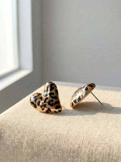 Leopard heart earrings close-up showing gold plating and animal print detail