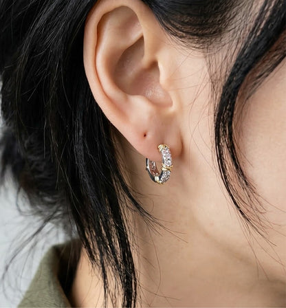 Two-Tone CZ Criss-Cross Huggie Hoop Earrings – 925 Sterling Silver, Gold X Detail