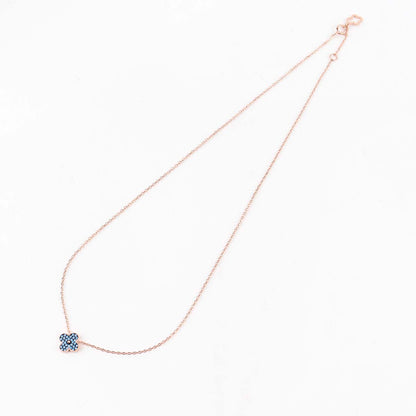 Full length view of rose gold clover necklace with extender chain