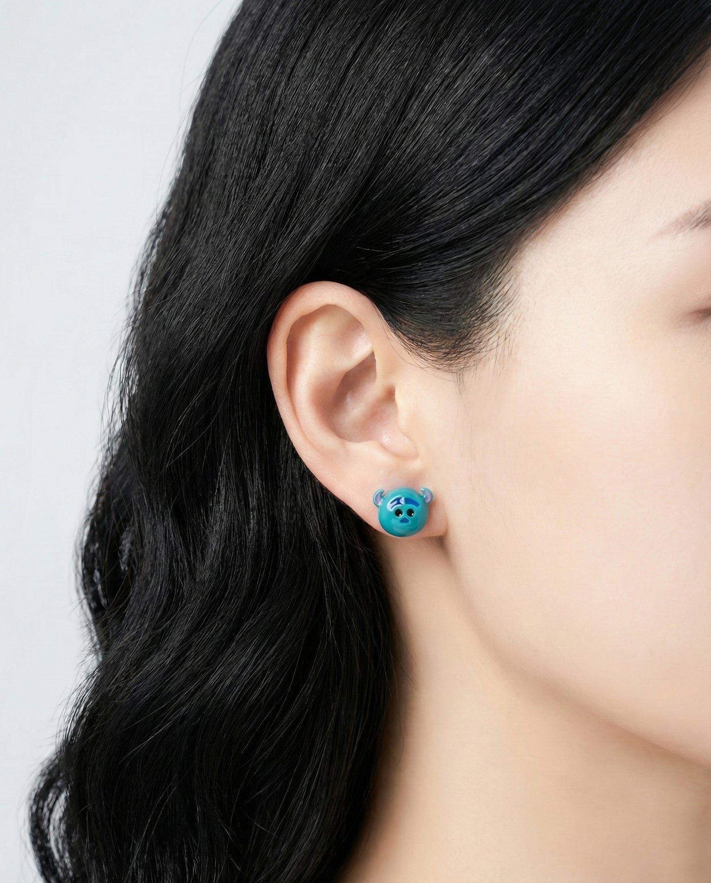 Sulley from Monsters Inc Tsum Tsum stud earring worn on ear - turquoise blue character jewelry