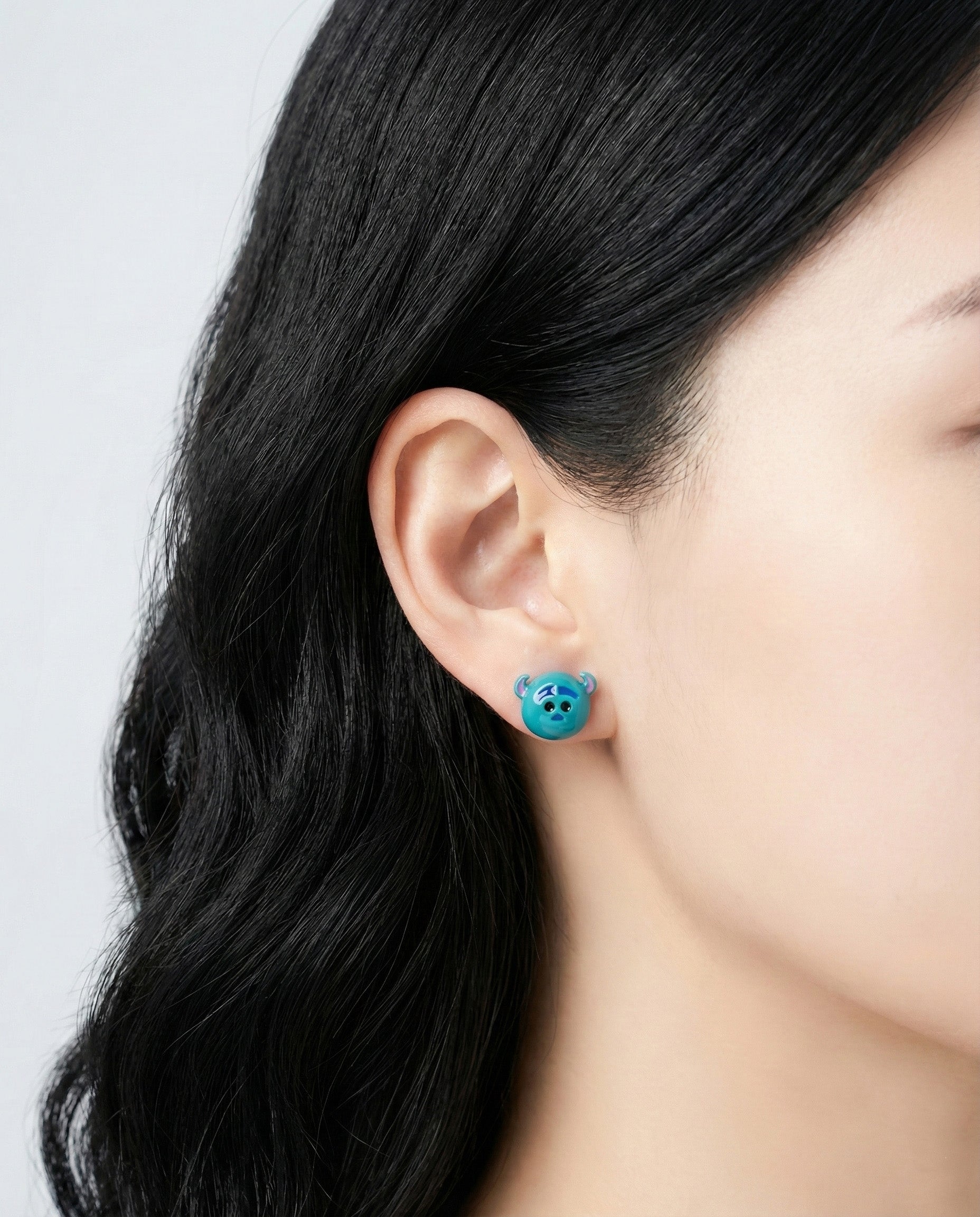 Sulley from Monsters Inc Tsum Tsum stud earring worn on ear - turquoise blue character jewelry