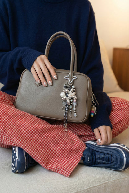 Silver chrome balloon dog bag charm with black and white rope pearl beads