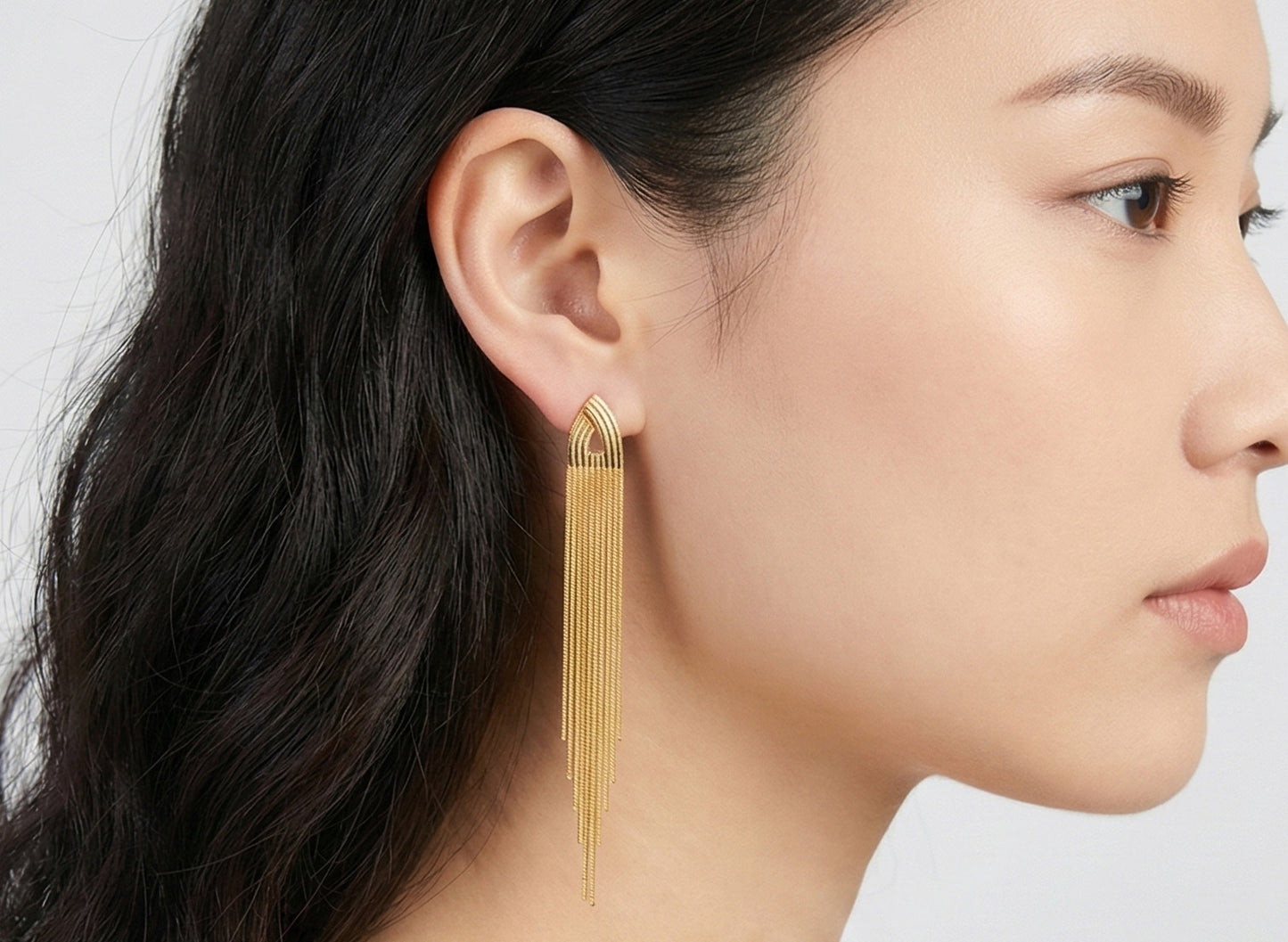 Front view of gold waterfall chain earrings with titanium posts, luxury tassel jewelry