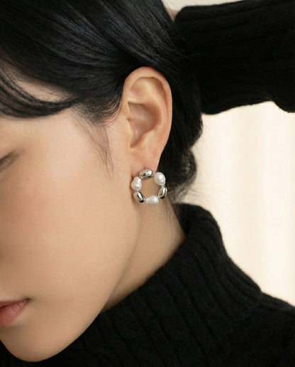 Silver baroque freshwater pearl wreath hoop earrings worn on ear showing comfortable fit and natural pearl luster
