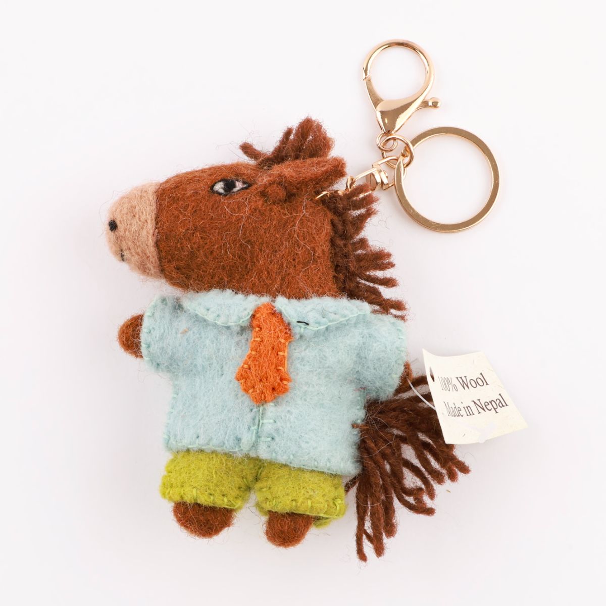 Brown felt horse bag charm with gold keyring and Made in Nepal tag