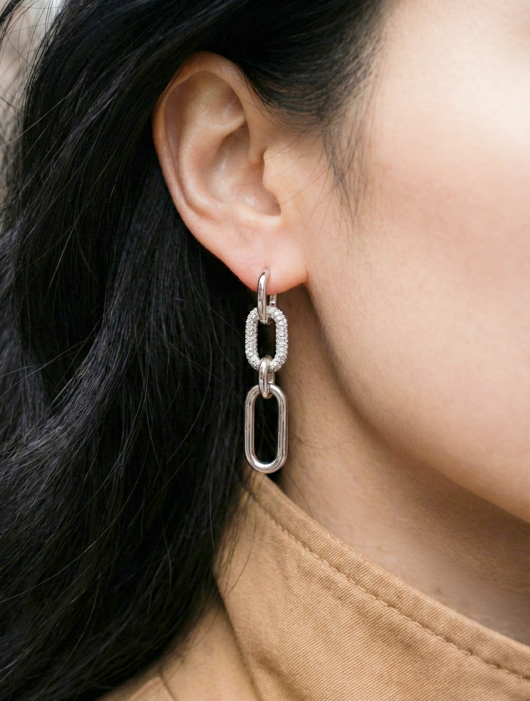 Silver chain link drop earrings with pavé CZ accent, casual chic styling with beige outfit