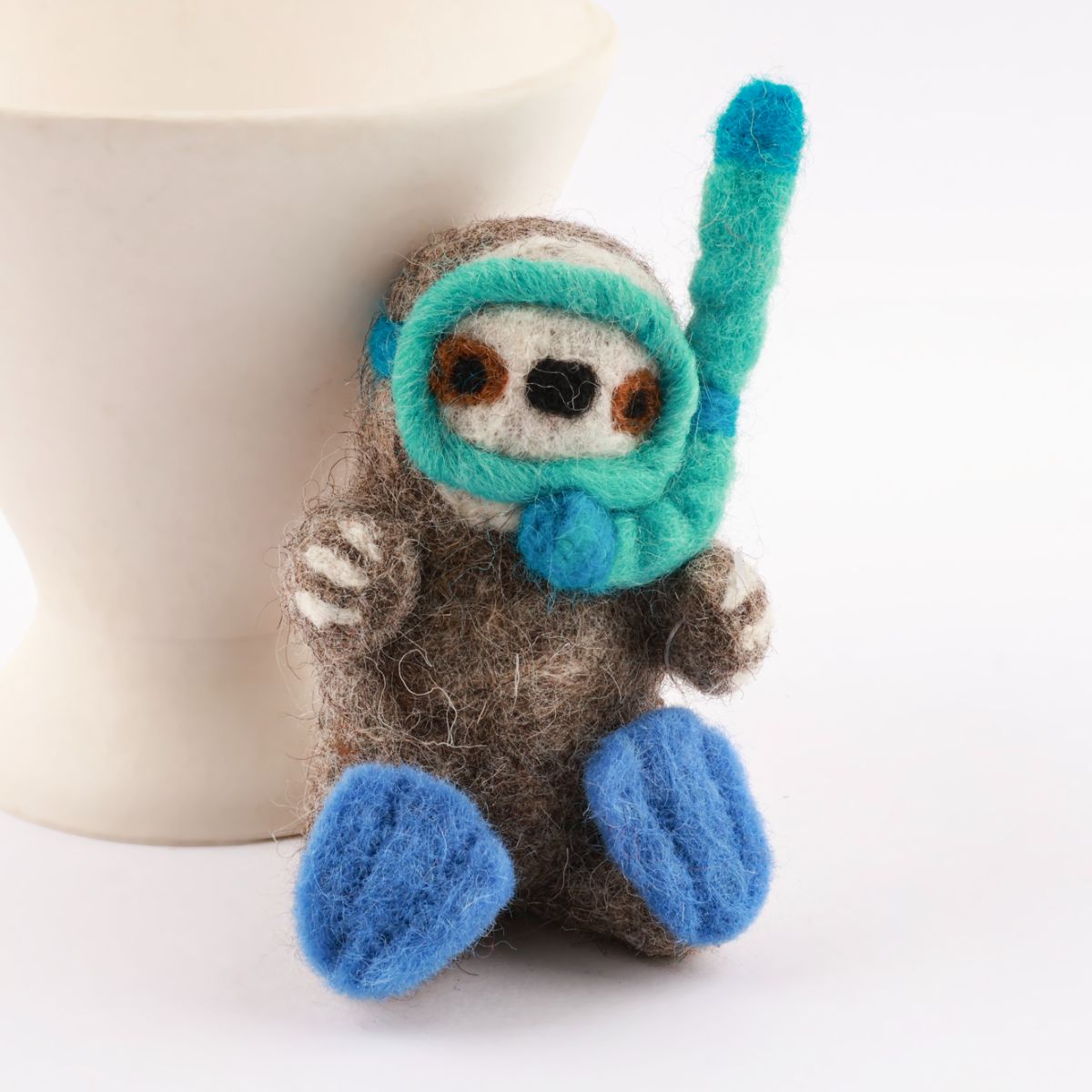 Diving otter wool felt keychain with turquoise goggles and blue flippers handmade in Nepa