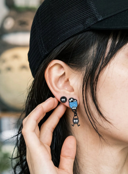 Curated ear piercing aesthetic with New Era cap, K-style soot sprite earrings pair.