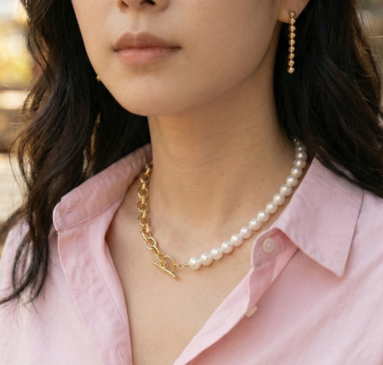  Half-and-half pearl and gold chain choker styled with blush pink button-down shirt