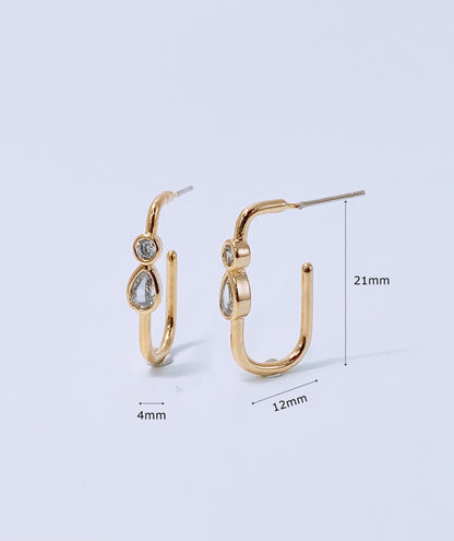 Product dimension measurement of gold bezel-set U-hoop earrings showing 21mm height and 12mm width with titanium post