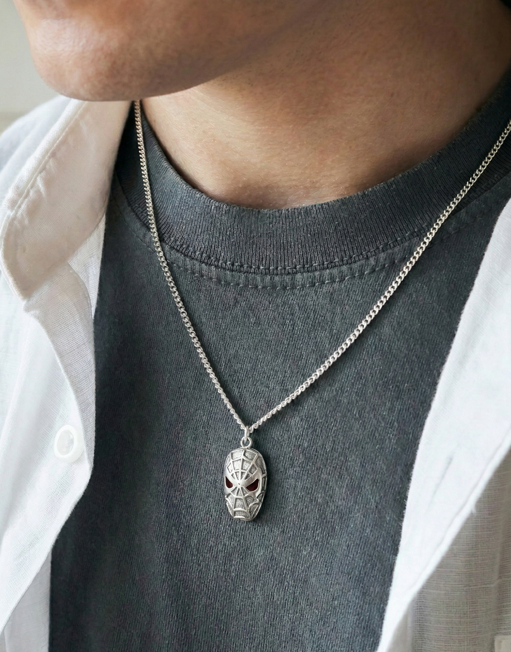  Man wearing a handmade 925 silver spider necklace over a dark grey t-shirt