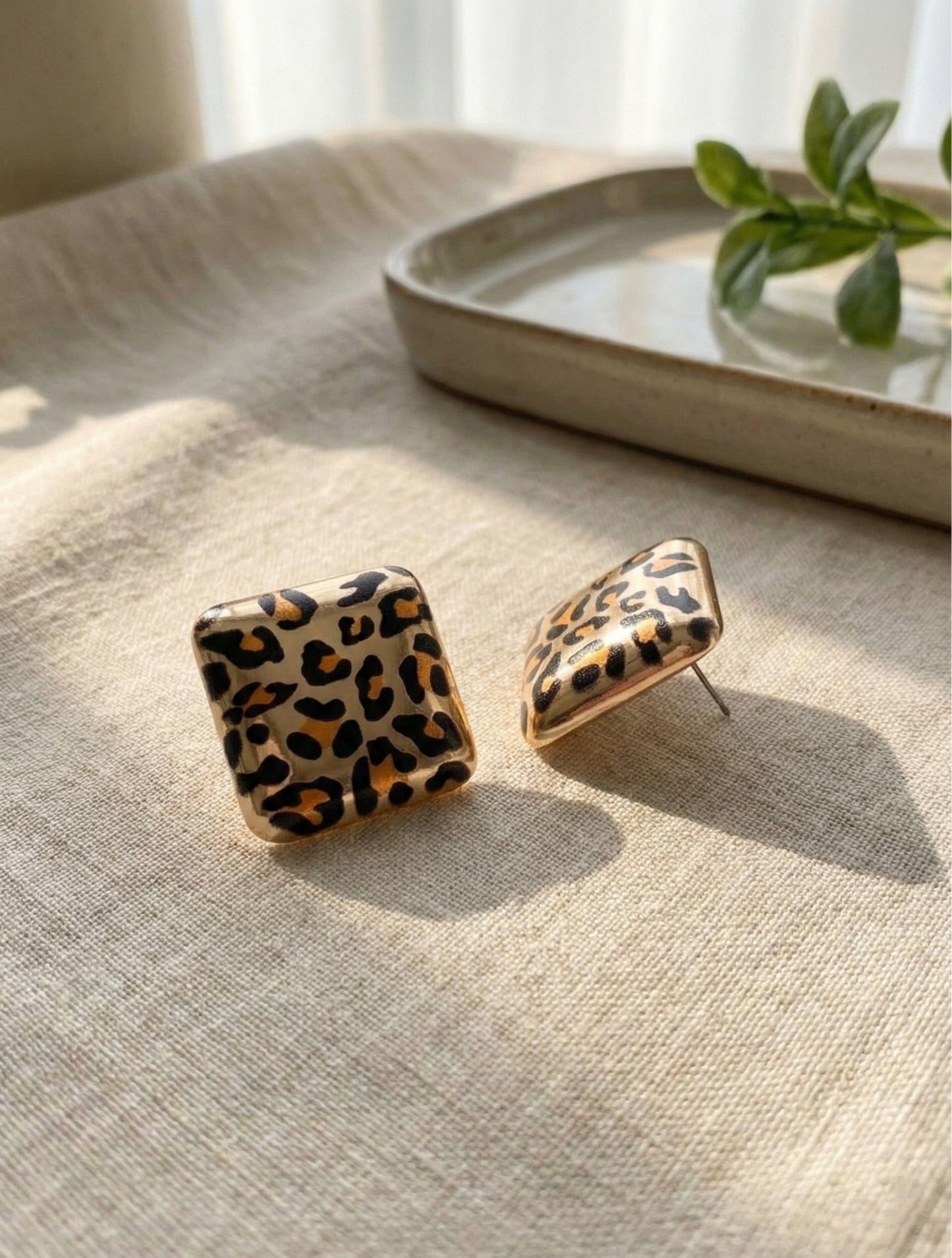 Leopard square earrings product shot showing CCB material and texture