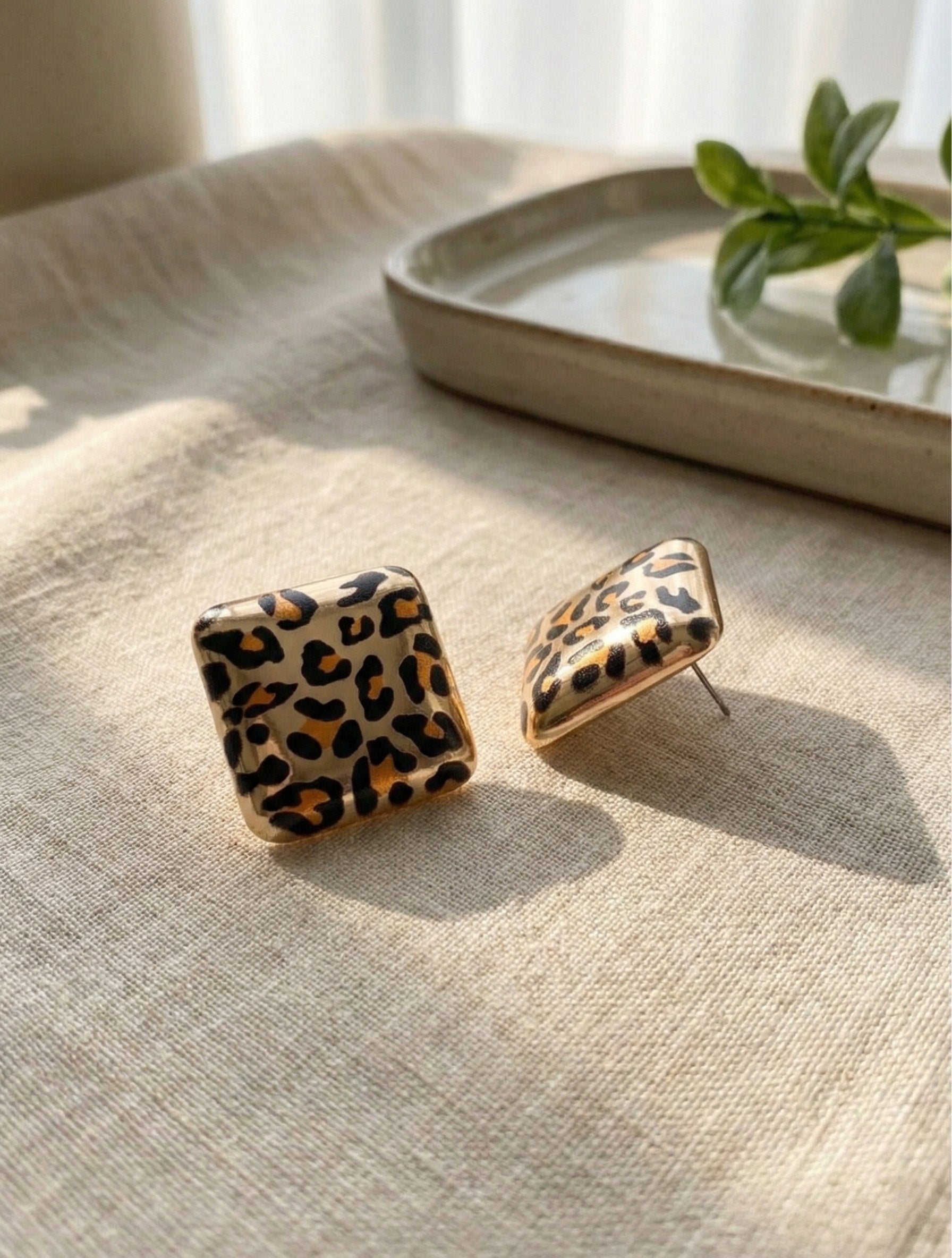 Leopard square earrings product shot showing CCB material and texture