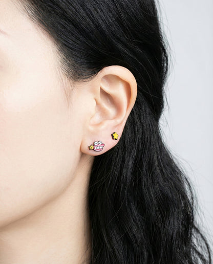 Mix and match styling with Chocobi pink mascot earring and gold star stud, multiple piercings earscape look