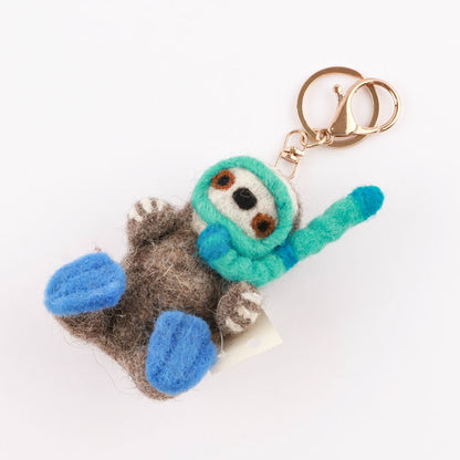 Diving otter wool felt keychain with turquoise goggles and blue flippers handmade in Nepa