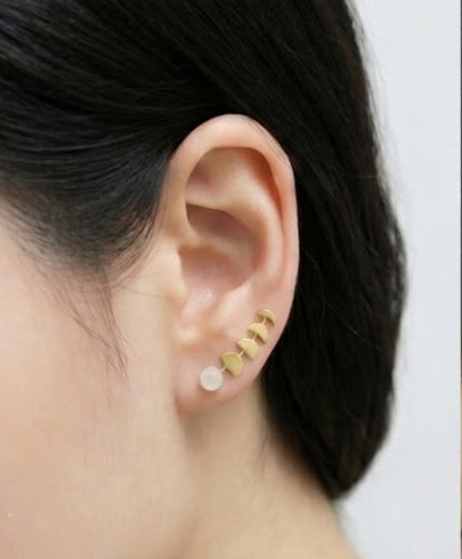 Gold moon phase ear climbers with faux moonstone worn on ear