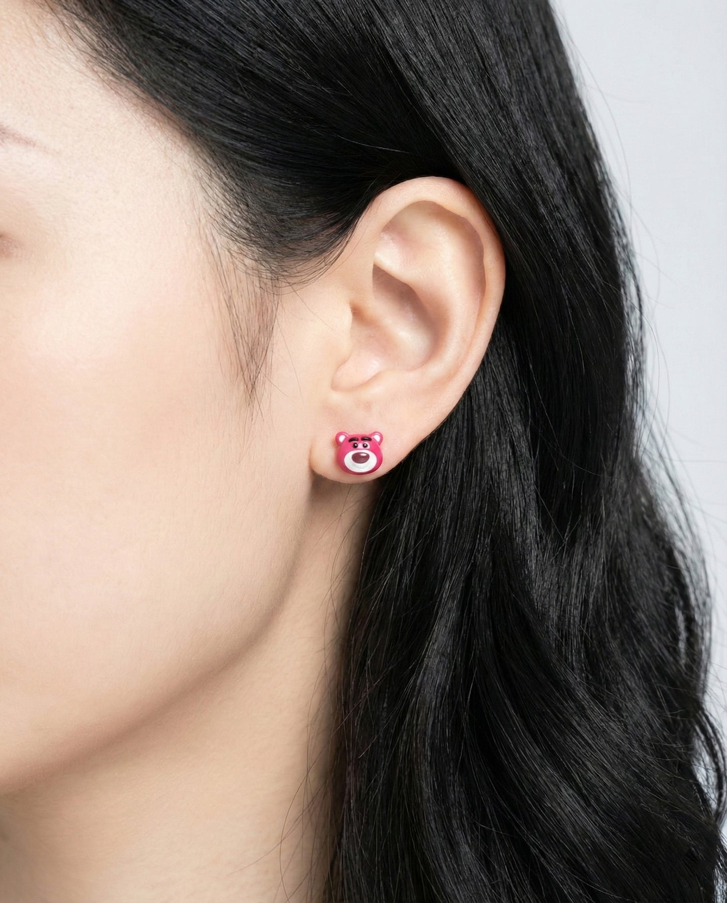 Lotso Bear hot pink Tsum Tsum stud earring worn on ear - Toy Story character set jewelry
