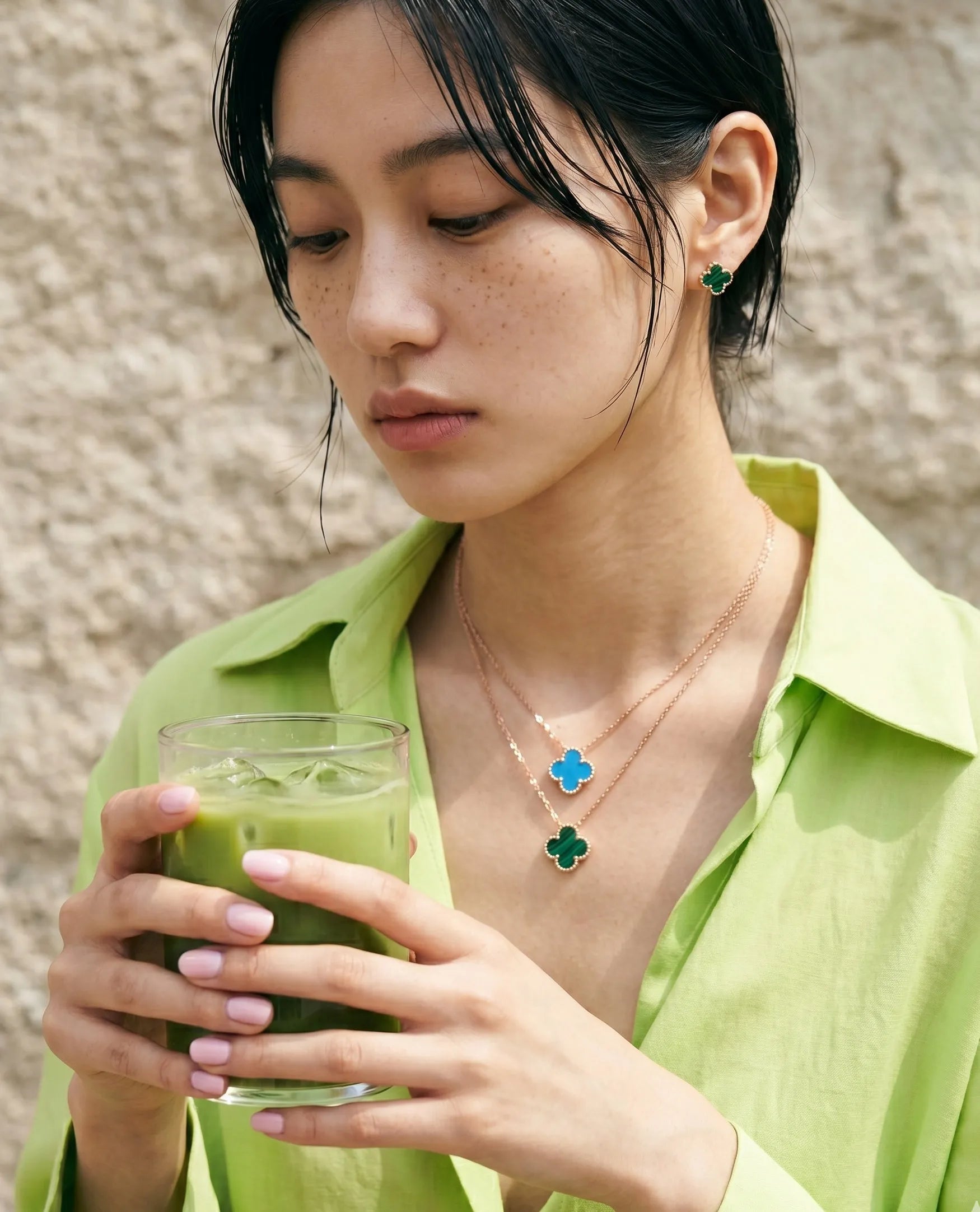 Turquoise and malachite clover necklace double layer with malachite earring on lime green linen shirt summer jewelry stack