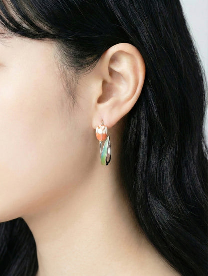 Woman modeling pink watercolor tulip hoop earrings for spring outfit