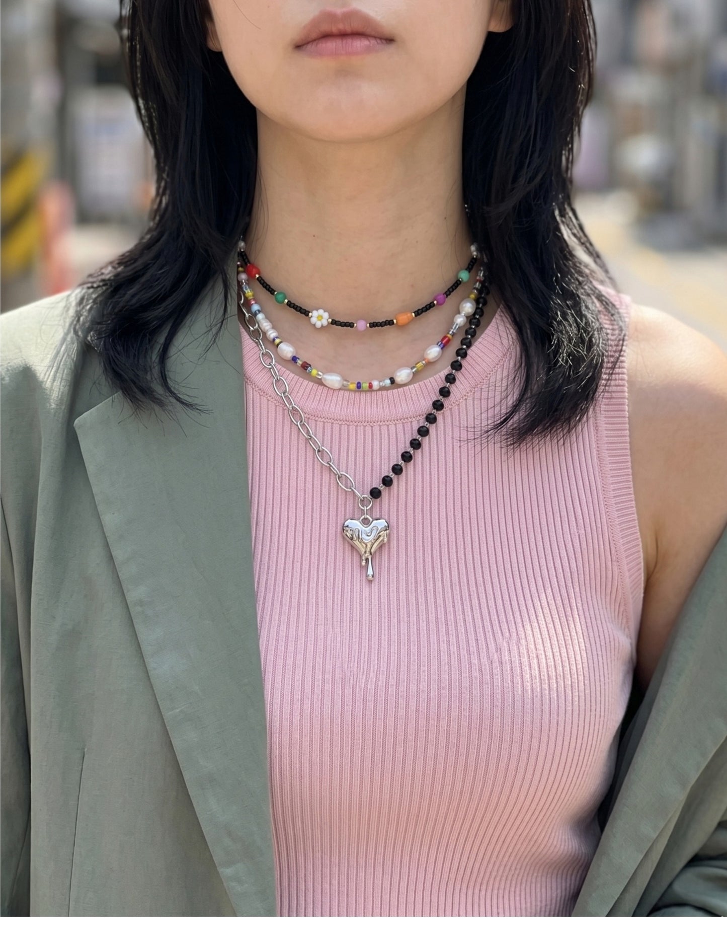 Y2K layered necklace stack inspo melting heart pendant with colorful bead choker, festival jewelry Korean street style