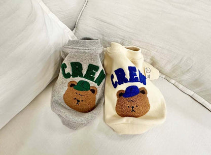 Cream and grey dog sweatshirts with CREW teddy bear design