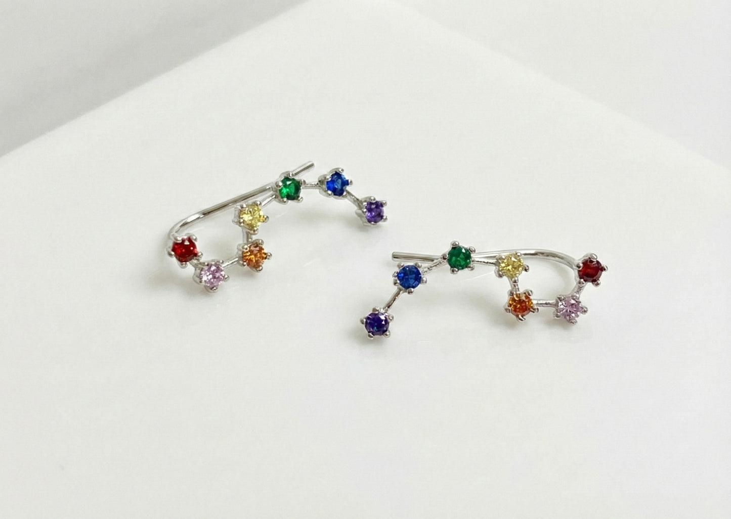 Rainbow Big Dipper constellation ear climber earrings with seven colorful cubic zirconia stones in silver finish