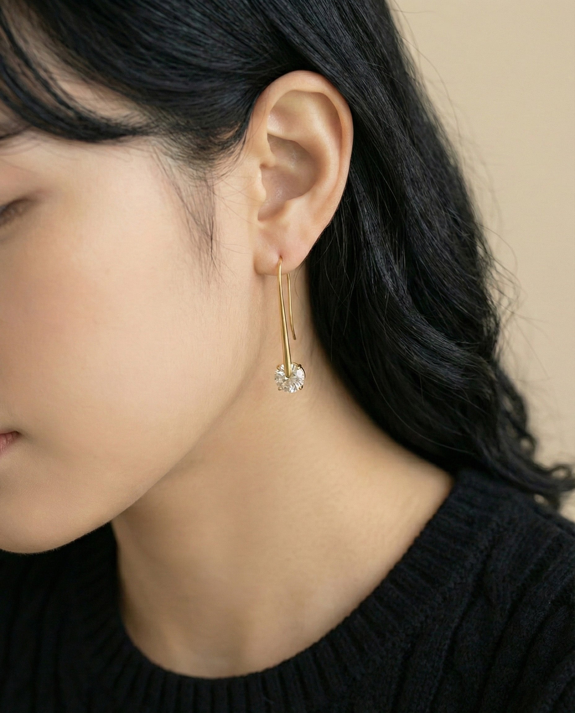  Back profile of model wearing silver U-hook drop earrings showing graceful 43mm length