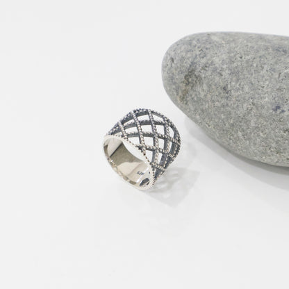 925 sterling silver lace lattice wide band ring on white surface next to gray stone, inner 925 hallmark stamp visible, antique beaded lattice detail