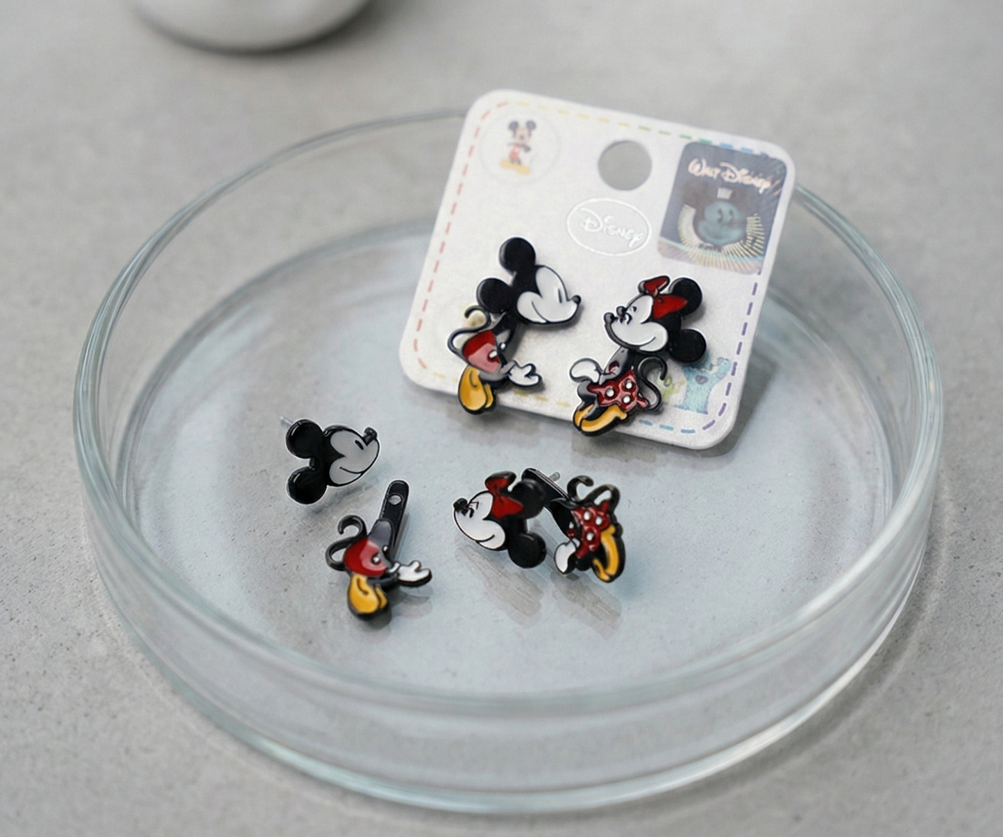Top view of Disney running pose Mickey and Minnie front-back earrings showing detailed enamel coloring