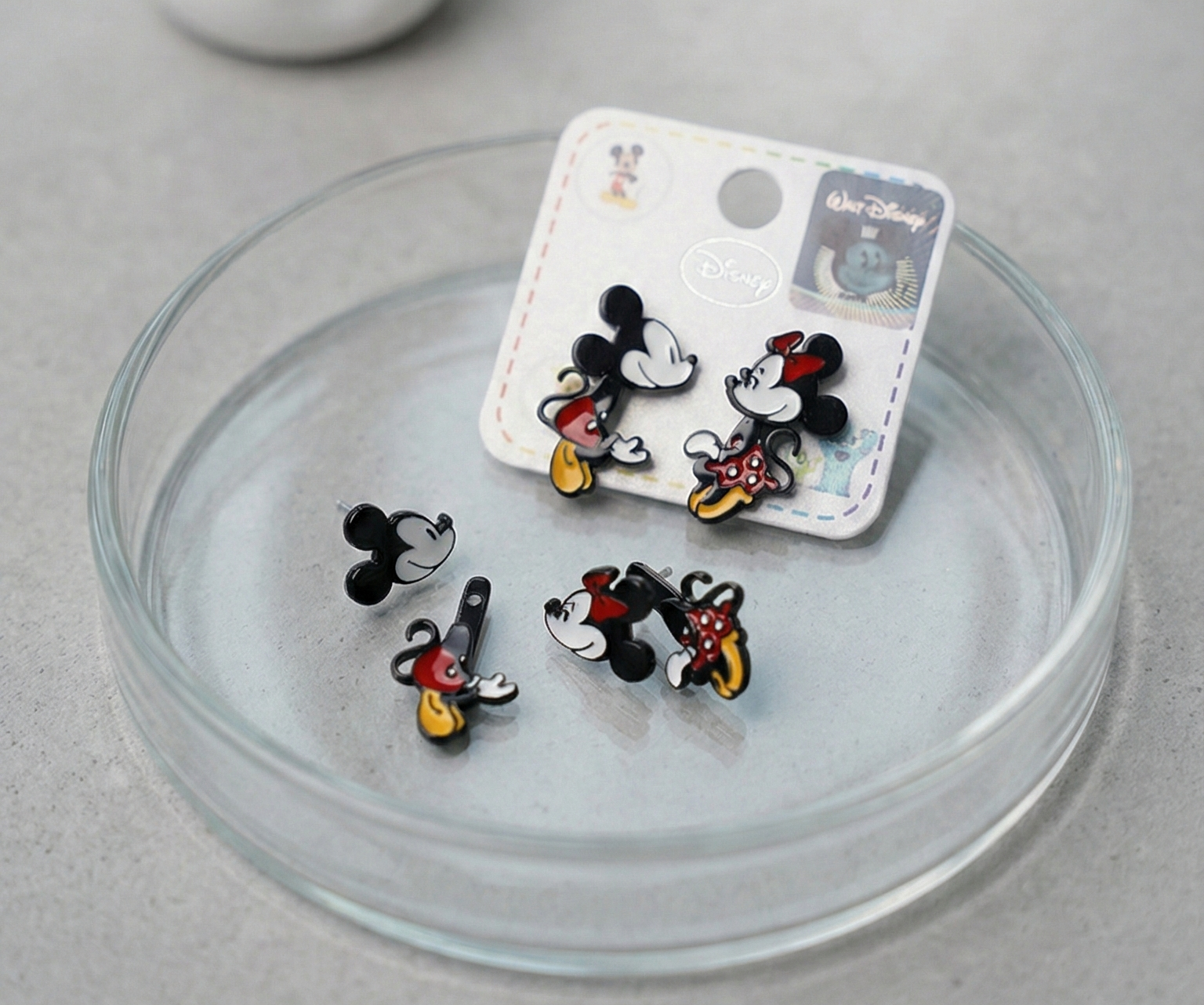 Top view of Disney running pose Mickey and Minnie front-back earrings showing detailed enamel coloring